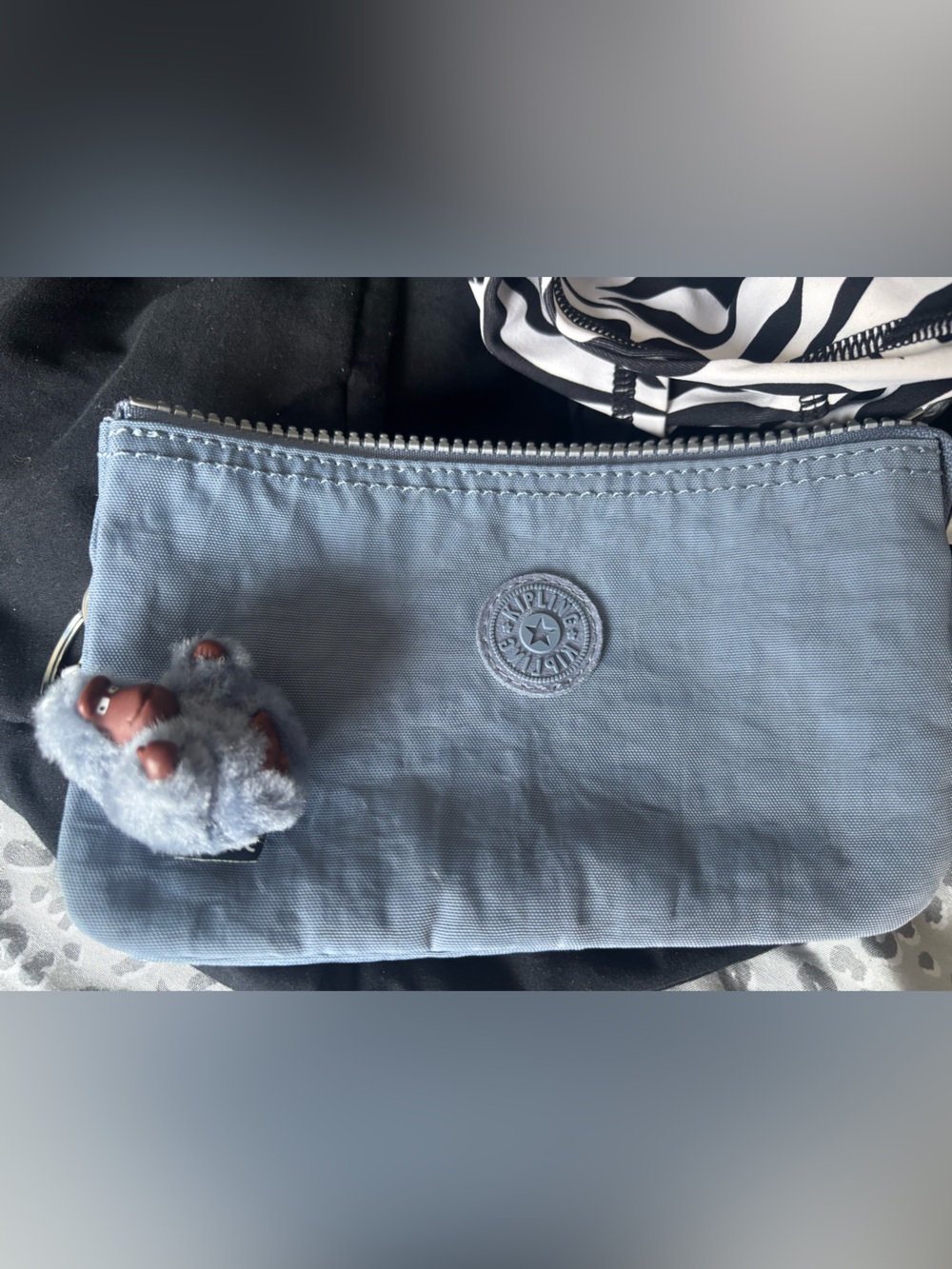 Kipling Powder Blue Nylon Pouch with Plush Monkey Charm